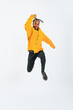 © metamorworks - Full body photo of a black man jumping in front of a white background