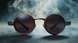 © Tcukimay - A pair of round sunglasses with dark lenses sit on a dark, textured surface.  Smoke swirls behind the sunglasses, adding a mysterious, cool atmosphere.