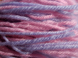 Wall Mural - Strands of pink and purple wool yarn abstract textured background