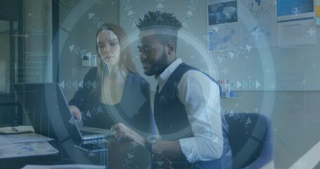 Poster - Business people working on laptops with digital interface animation over them