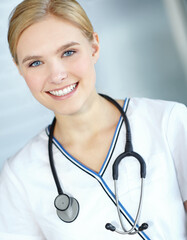 Healthcare, doctor and portrait of woman, smile and confident with stethoscope, intern and hospital. Happy, medical professional and trainee in clinic, proud and profession to help and pediatrician