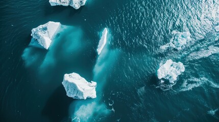 Wall Mural - the unique beauty of icebergs floating in the ocean from an aerial viewpoint.