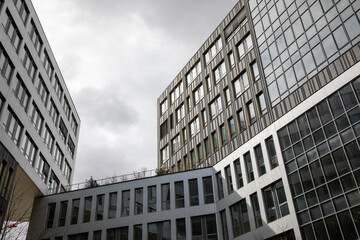 Large office buildings in city perspective facade with office windows in towns