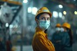 © Anjali - Female factory worker and engineer wearing masks during pandemic.