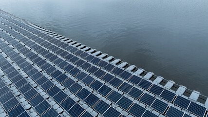 Aerial view hydro floating solar hybrid power plant, Hydro floating solar panel platform system on the lake, Power plant renewable energy source, Eco technology electric power industry.