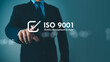 © Thawatchai Images - ISO 9001 Standard certification standardisation quality control concept. Businessman point your finger at text ISO 9001 for quality management of organizations, Certified and quality.