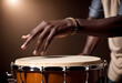 © Mike - A black African man playing a drum