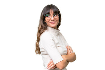 Young caucasian woman over isolated background looking to the side and smiling