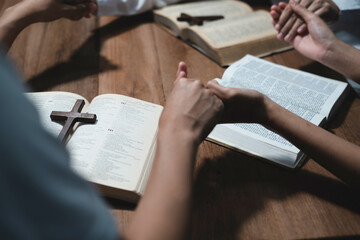 Sticker - Asian men and women hands praying to god with the bible. Pray for god blessing. Religious beliefs Christian life crisis prayer to god.