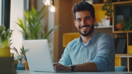 Canvas Print - Modern office scene with a stylish Hispanic businessman working on an e-commerce startup, smiling