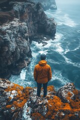 Wall Mural - Someone standing on a cliff overlooking the ocean and a cliff, travel concept