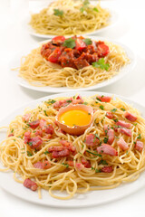 Wall Mural - plate of spashetti with different sauce, carbonara, tomato sauce or pesto sauce