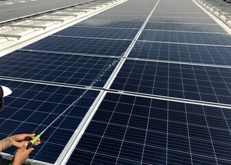 Cleaning solar photovoltaic (PV) panels activity by worker