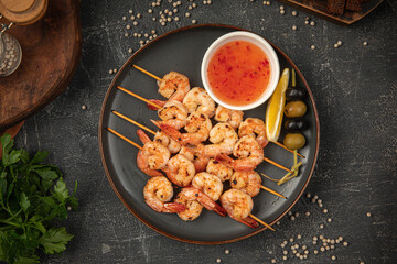 Sticker - Portion of shrimp skewers with sweet and sour sauce