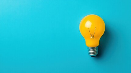 Canvas Print - Yellow Light Bulb on a Blue Background