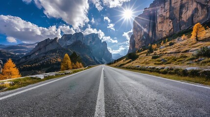 Aufkleber - Road in mountains at sunny day in golden autumn Dolomites Italy Beautiful roadway orange tress high rocks blue sky with clouds Landscape with empty highway through the mountain pass in : Generative AI