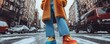 © Woranittha - A young person in a faux fur coat, wide-leg jeans, and colorful sneakers, accessorized with bold jewelry, showcasing the eclectic nature of street style