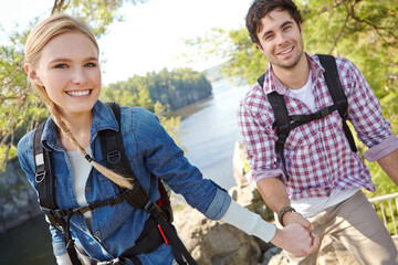 Holding hands, nature or happy couple hiking by lake for travel, outdoor adventure or journey. River, woods or people in forest together on holiday vacation, mountain trip or break to explore park