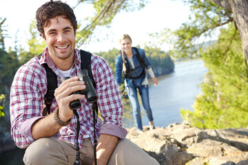 Wall Mural - Happy man, binocular or couple in portrait or forest for outdoor adventure or birdwatching in woods. Mountain, view or people sightseeing in nature on holiday vacation, lake or break to explore park