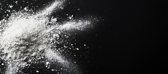 White powder on black background, close-up, top view