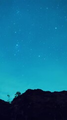 Wall Mural - timelapse - rivers, mountain stars, zodiacal light and the milky way on a beautiful blue night in ne