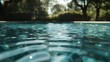 © Nehtott - Water Ripples: Water ripples in a pool with no visible object, suggesting an invisible floating pool toy.