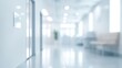 © Boinah - A blurred hallway in a modern office or medical facility, emphasizing a clean, spacious environment.