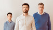 © Prostock-studio - Middle-Aged Guy Standing Next To Little Son And Senior Father Posing Against White Wall Indoor. Male Generations. Panorama, Selective Focus