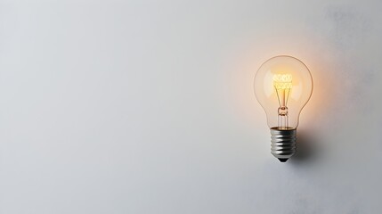 Poster - minimalist light bulb isolated on a clean white background representing a creative idea innovation o