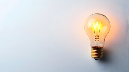 Poster - Glowing light bulb isolated on a clean white background representing a new idea innovation or breakthrough  This minimalist image conveys the concept of creativity ingenuity