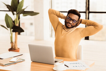 Aufkleber - Time For Break. Successful black stock trader in glasses stretching hands at workplace, free space