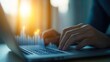 © BoOm - A close-up of hands typing on a laptop keyboard with digital data visualization overlay, reflecting modern technology and productivity.