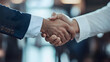 © JADE - Corporate Handshake: Symbol of Professional Success and Agreement in a Modern Office Setting