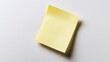 © MakoPoko - A yellow sticky note floating on a clean white background, providing a minimalist and versatile visual for various uses.
