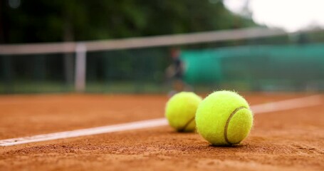 Wall Mural - people play tennis outdoor on clay court. closeup of tennis ball