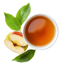 A cup of apple cider vinegar with a half of apple and green leaves.