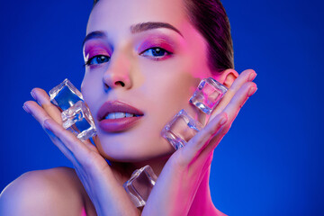 Photo of stunning girl touch hold ice crystal cubes applying isolated neon vivid color background