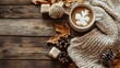 © pinporn manosri - A flat lay of a cozy knit sweater and cup of hot chocolate on a wooden floor, with a warm atmosphere