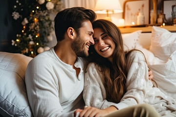 Sticker - Joyful Caucasian couple in cozy Christmas attire sharing a happy moment, enjoying the festive season together at home.