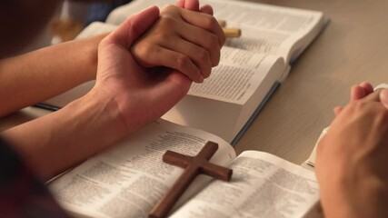 Wall Mural - Sense of devotion and spiritual fulfill with christian catholic follower immerse in faith. Slow motion christian people practicing group prayer, holding hand while praying together. Burgeoning