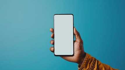 Poster - Male hand holding modern bezel-less smartphone with blank screen isolated on bright blue background, ideal for technology mockups, app design presentations, and mobile device promotions with screen cu