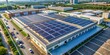 © Triple P - Aerial view of solar panels on factory roof, solar power, photovoltaic, renewable energy, industrial