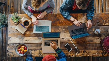 Poster - Group of people collaborating around wooden table with mockup laptop computer, engaged in work or discussion, ideal for business meetings, team projects, and technology use