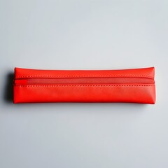 Poster - Centered photograph of a vibrant red pencil case placed on a plain neutral background  The simple minimalist composition highlights the bold color and shape of the stationery item