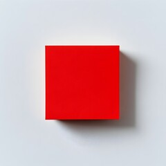 Poster - A simple and minimalist red sticky note holder placed at the center of a clean white surface creating a stylish and organized office or workspace composition