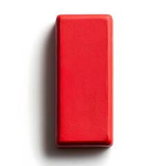 Poster - Closeup of a vivid red eraser placed at the center of a plain white background creating a simple and minimalist composition  This image could be used for various design or advertising purposes