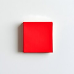 Poster - Minimalist and Elegant Red Sticky Note Pad Placed at the Center of a White Backdrop Ideal for Business Office Lifestyle or Interior Design Purposes