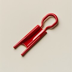 Poster - Closeup of a single red binder clip lying flat and isolated on a plain light colored background  Minimal simple and conceptual design for office stationery or administrative related photography