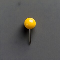 Poster - Close up Photograph of a Vibrant Yellow Push Pin Placed at the Center of a Simple Plain Background Surface
