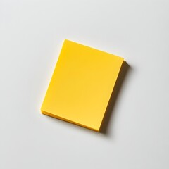 Poster - Close up View of a Yellow Sticky Note Holder Placed Centrally on a Clean White Background  This Stationery Accessory Offers Simple Storage and Organization for Office Supplies